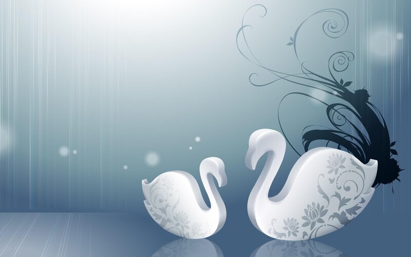 two swans with floral patterns