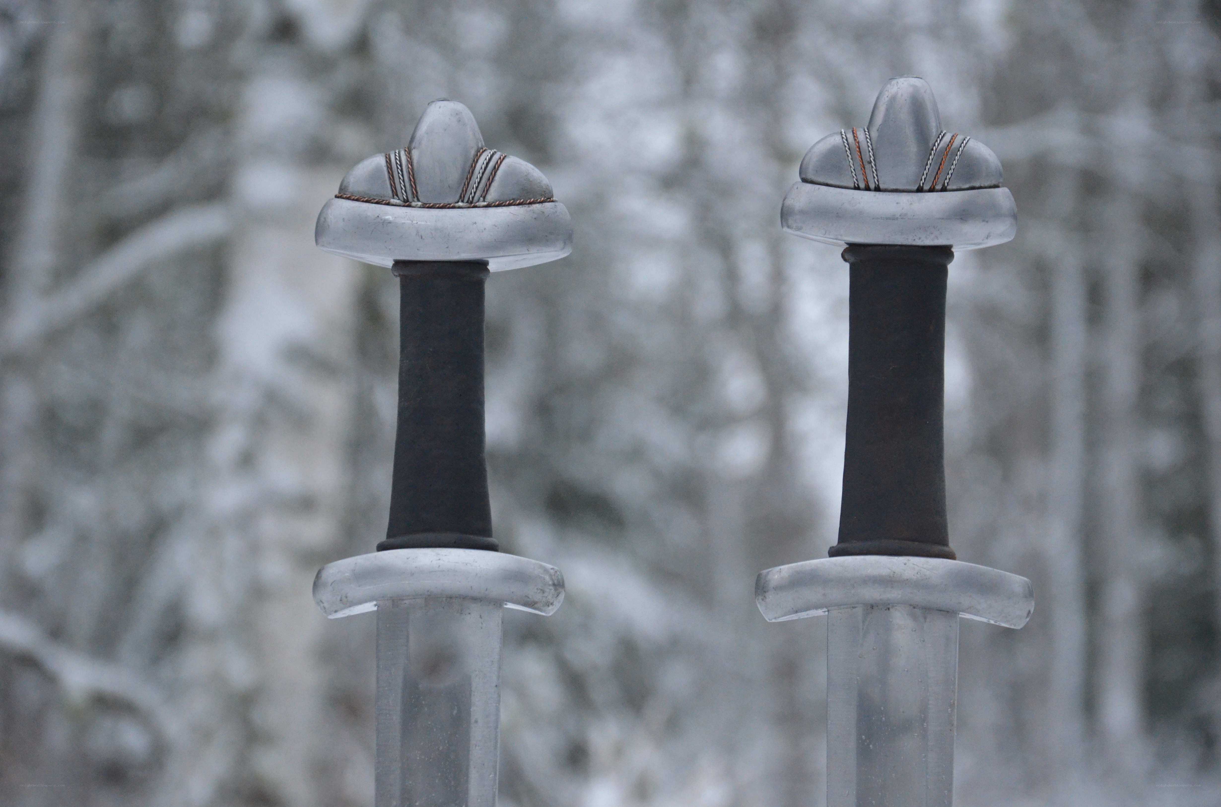 Two swords in snowy forest
