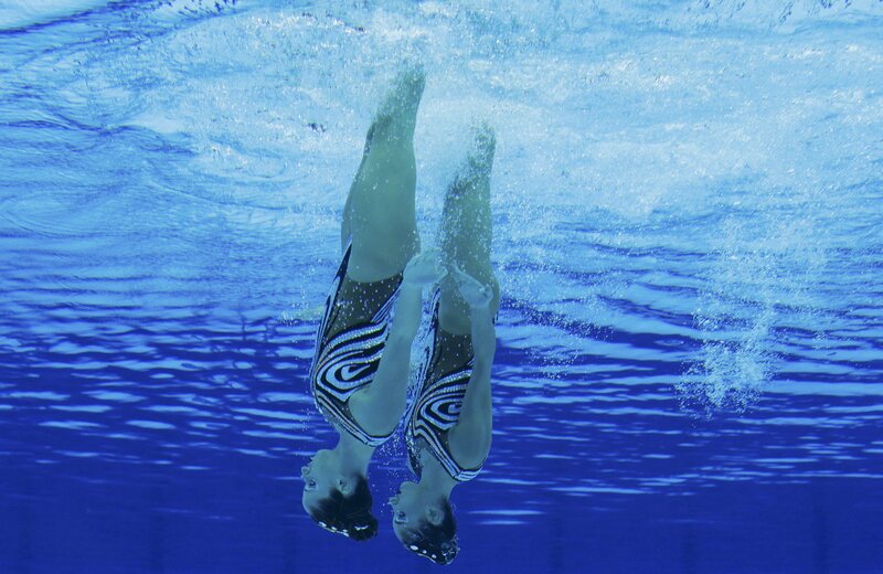 Two Synchronized Swimmers