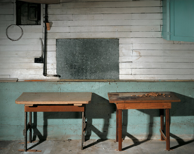 Two tables in a weathered room