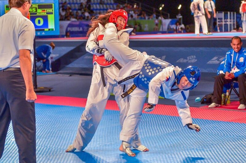 Two Taekwondo Athletes — Blue, Competitive