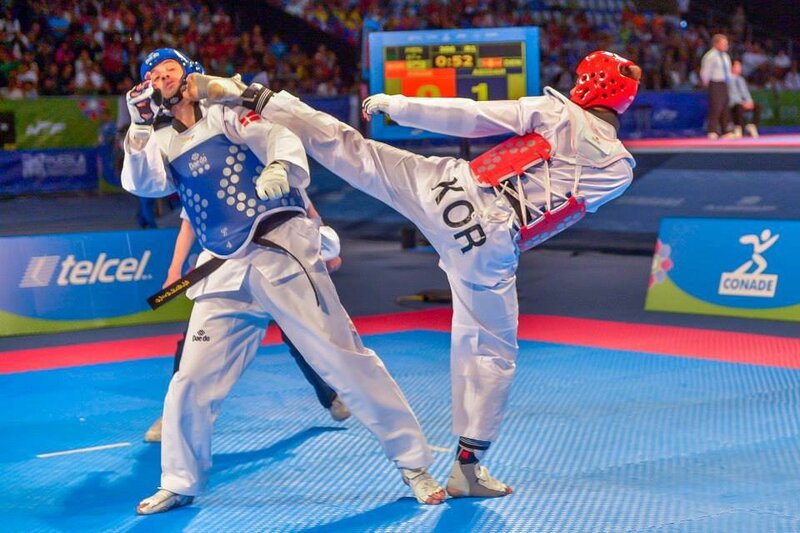 Two Taekwondo Fighters — Blue, Competitive, Night