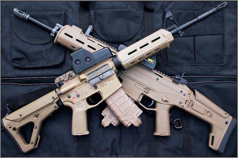 Two tan assault rifles