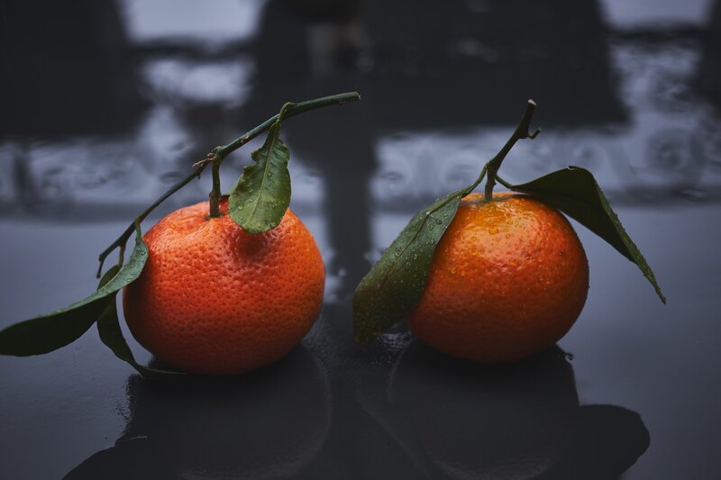 Two Tangerines on Surface