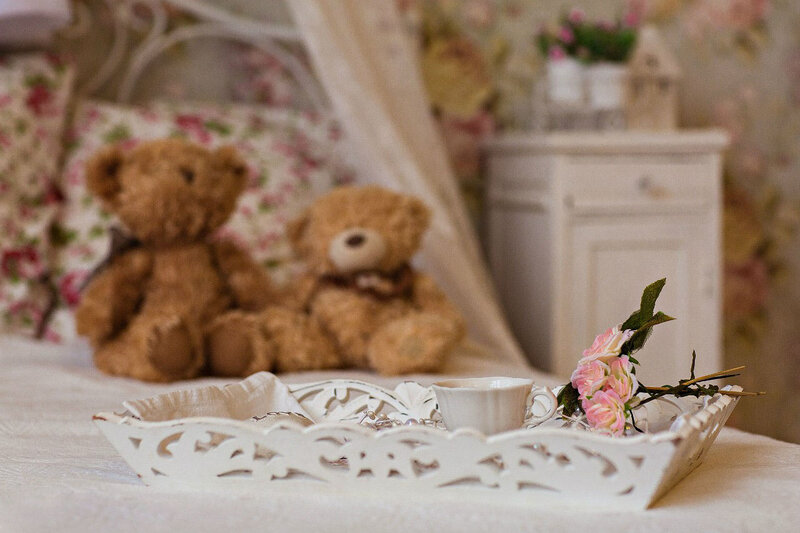 Two Teddy Bears on Bed