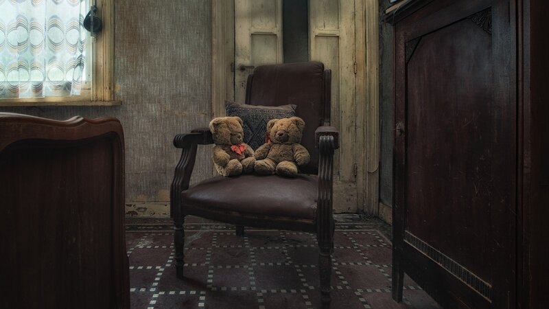 Two Teddy Bears on Chair — Brown