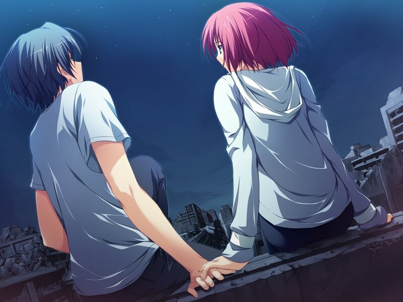 two teens holding hands at night