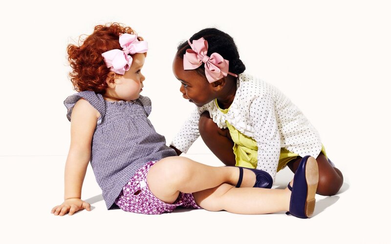 Two Toddlers Sitting — White