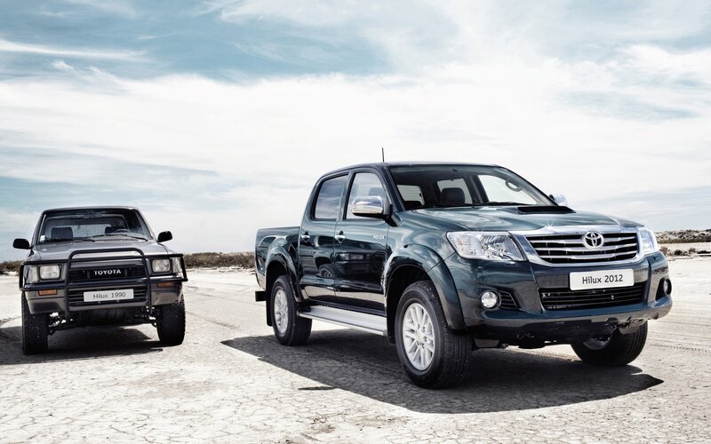 Two Toyota Hilux Trucks