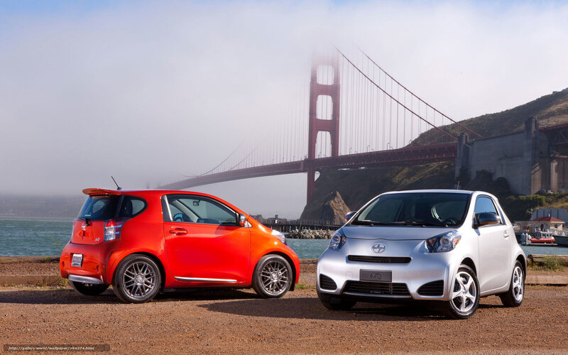 Two Toyota iQ cars by Golden Gate Bridge