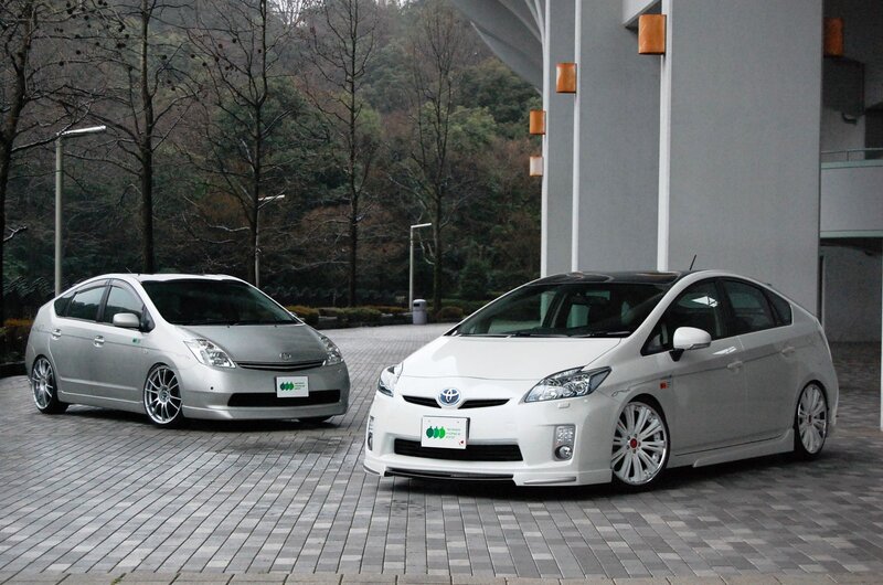 Two Toyota Prius cars parked