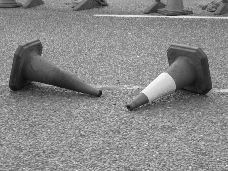 Two traffic cones on pavement