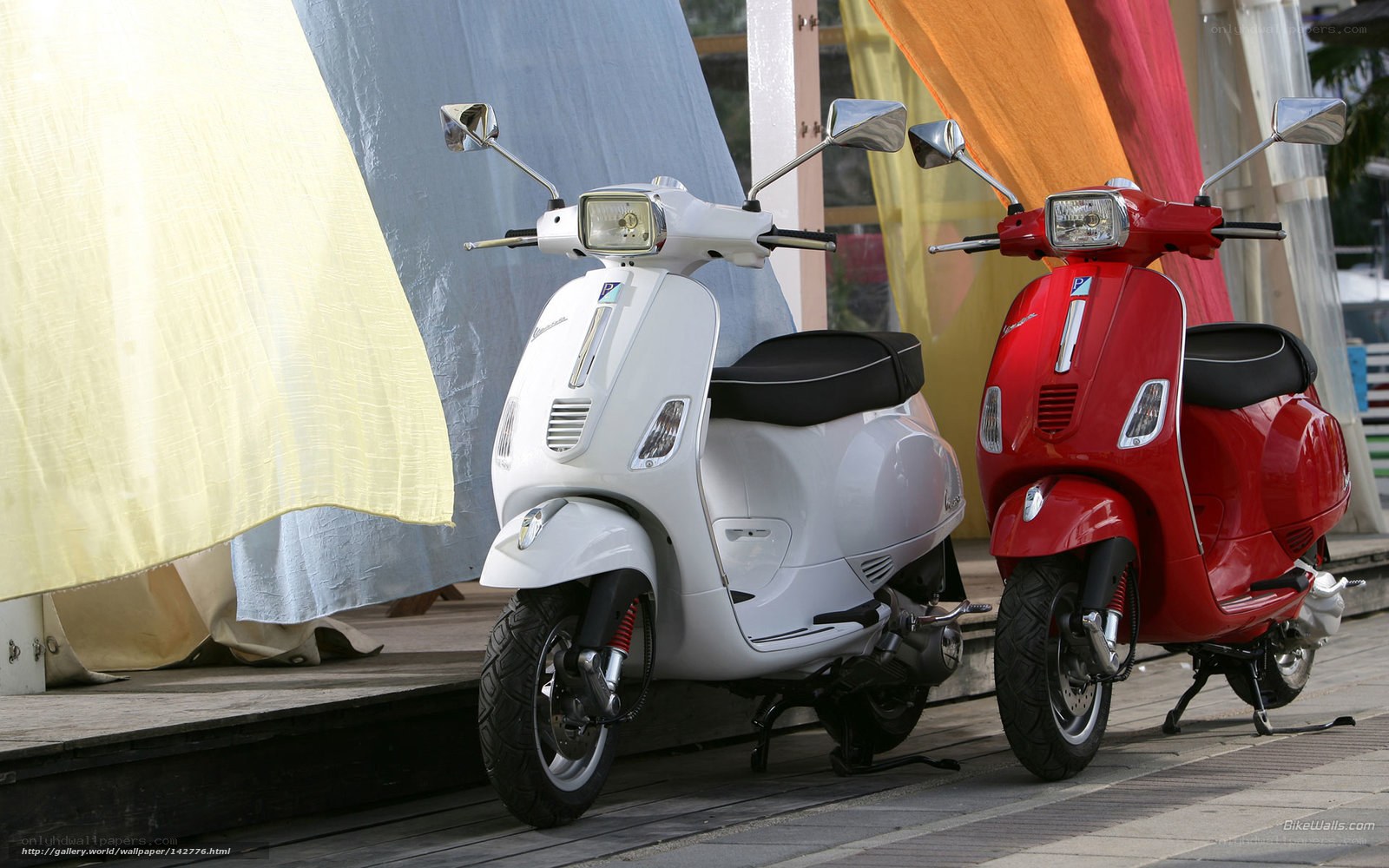 Two Vespa scooters side by side