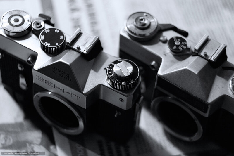 Two vintage cameras on newspaper