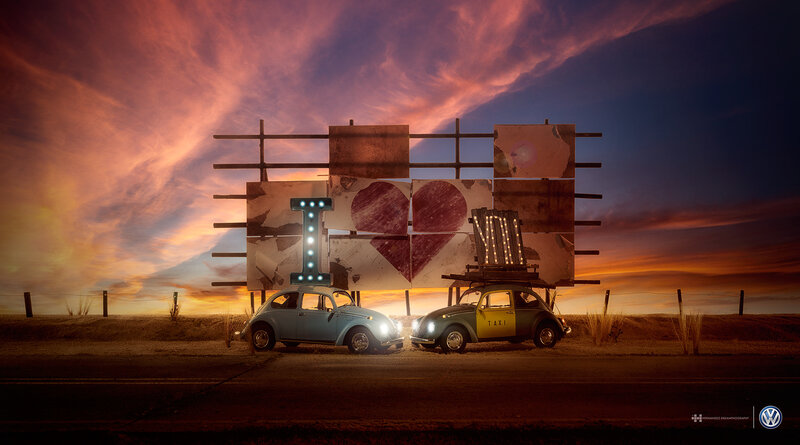 Two Vintage Cars at Sunset