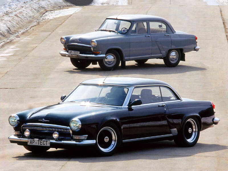 Two Vintage Cars on Pavement