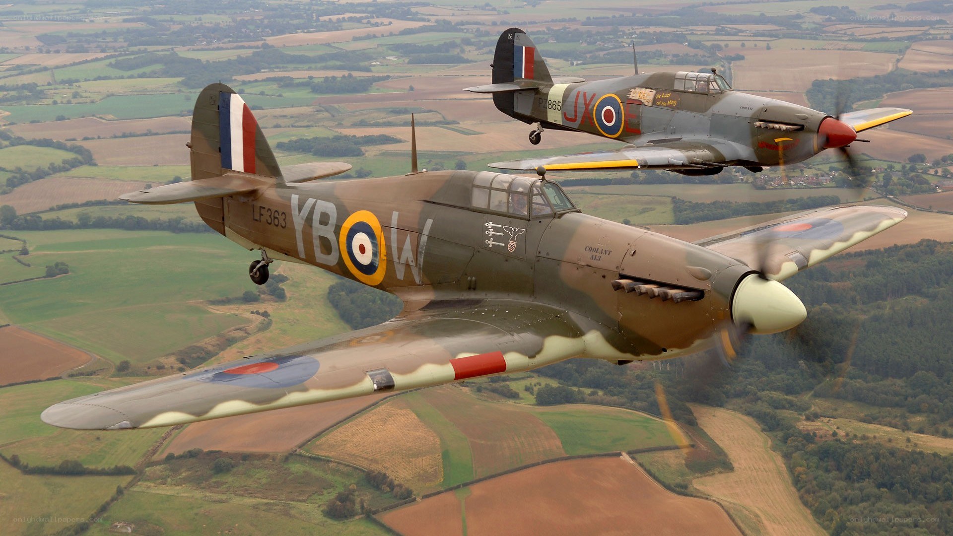 Two vintage fighter planes in flight