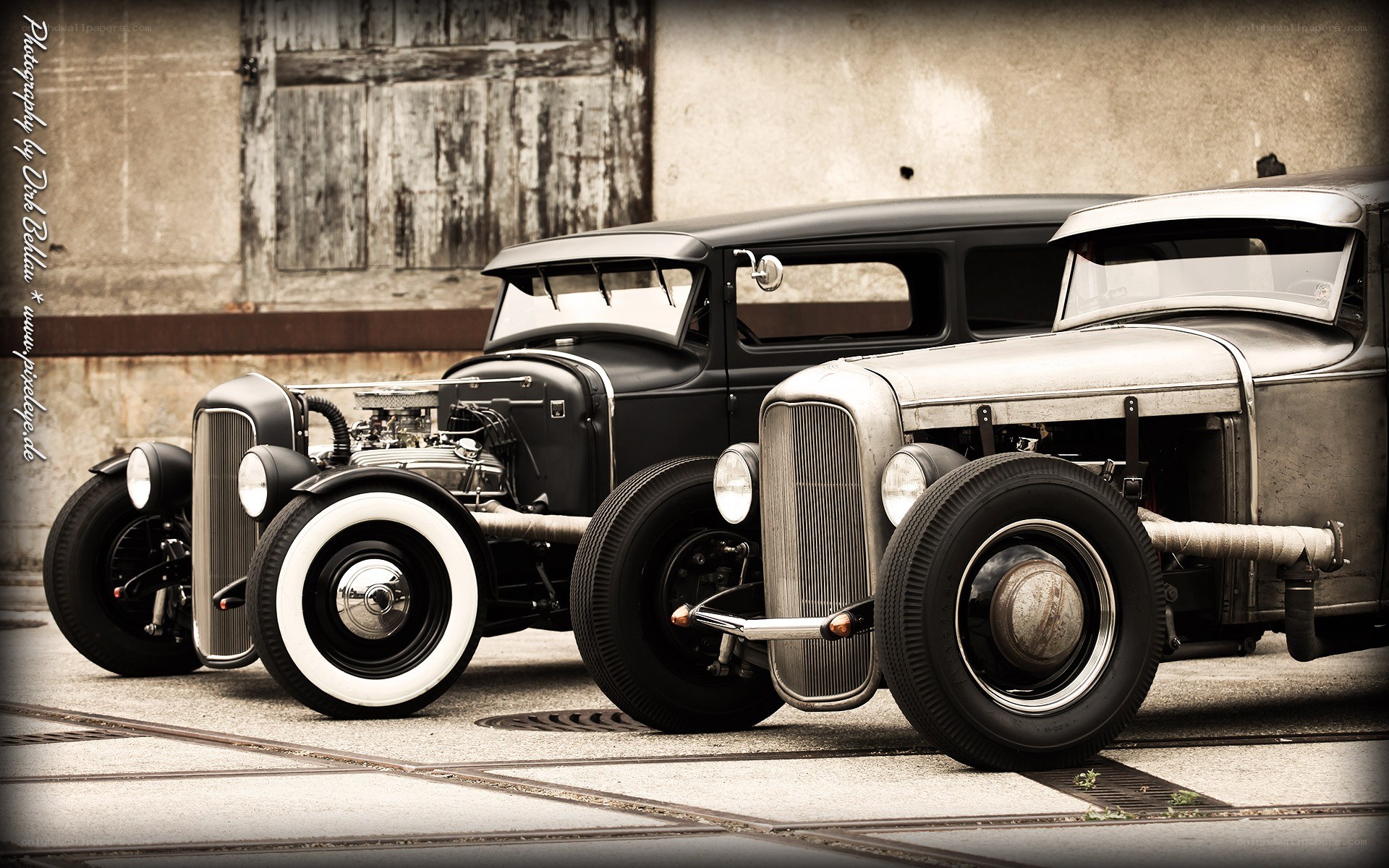 Two vintage hot rods parked