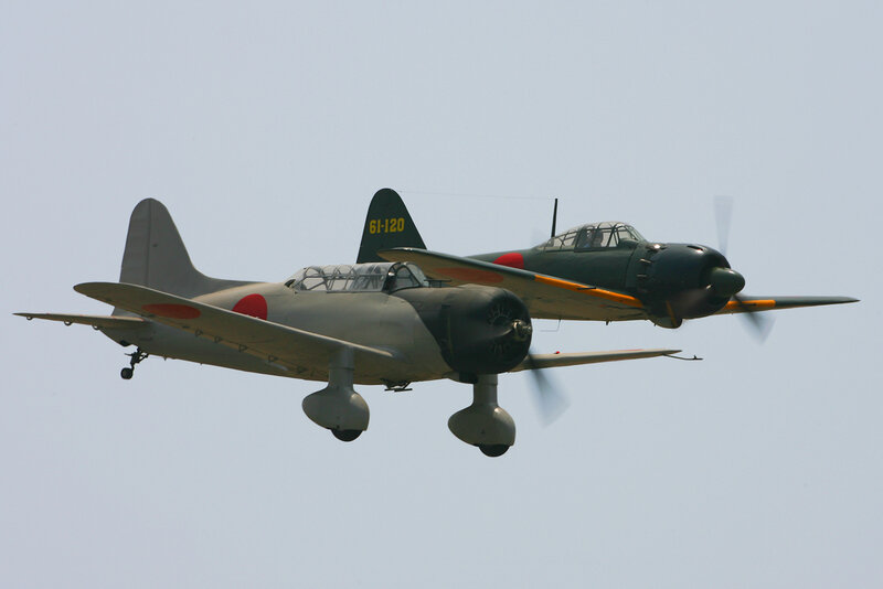 Two vintage Japanese aircraft in flight