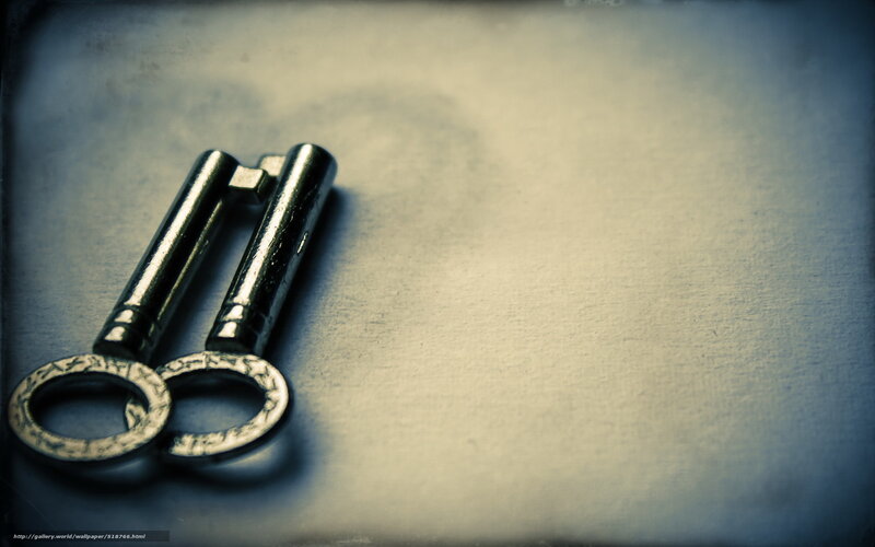 Two vintage keys on a surface