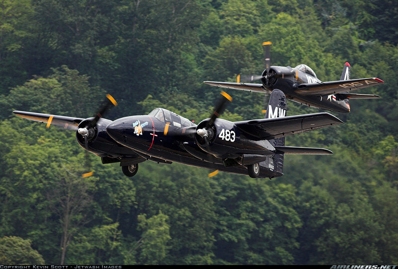 Two vintage military aircraft in flight