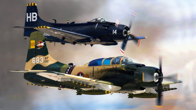 Two vintage military planes in flight
