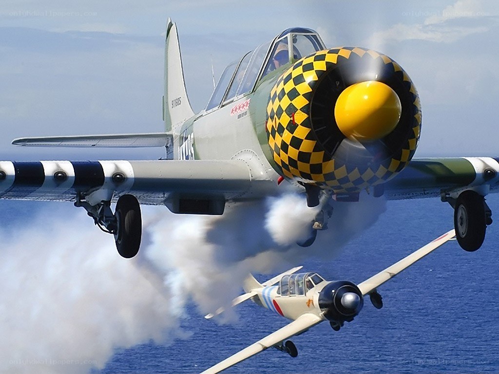 Two vintage planes in flight