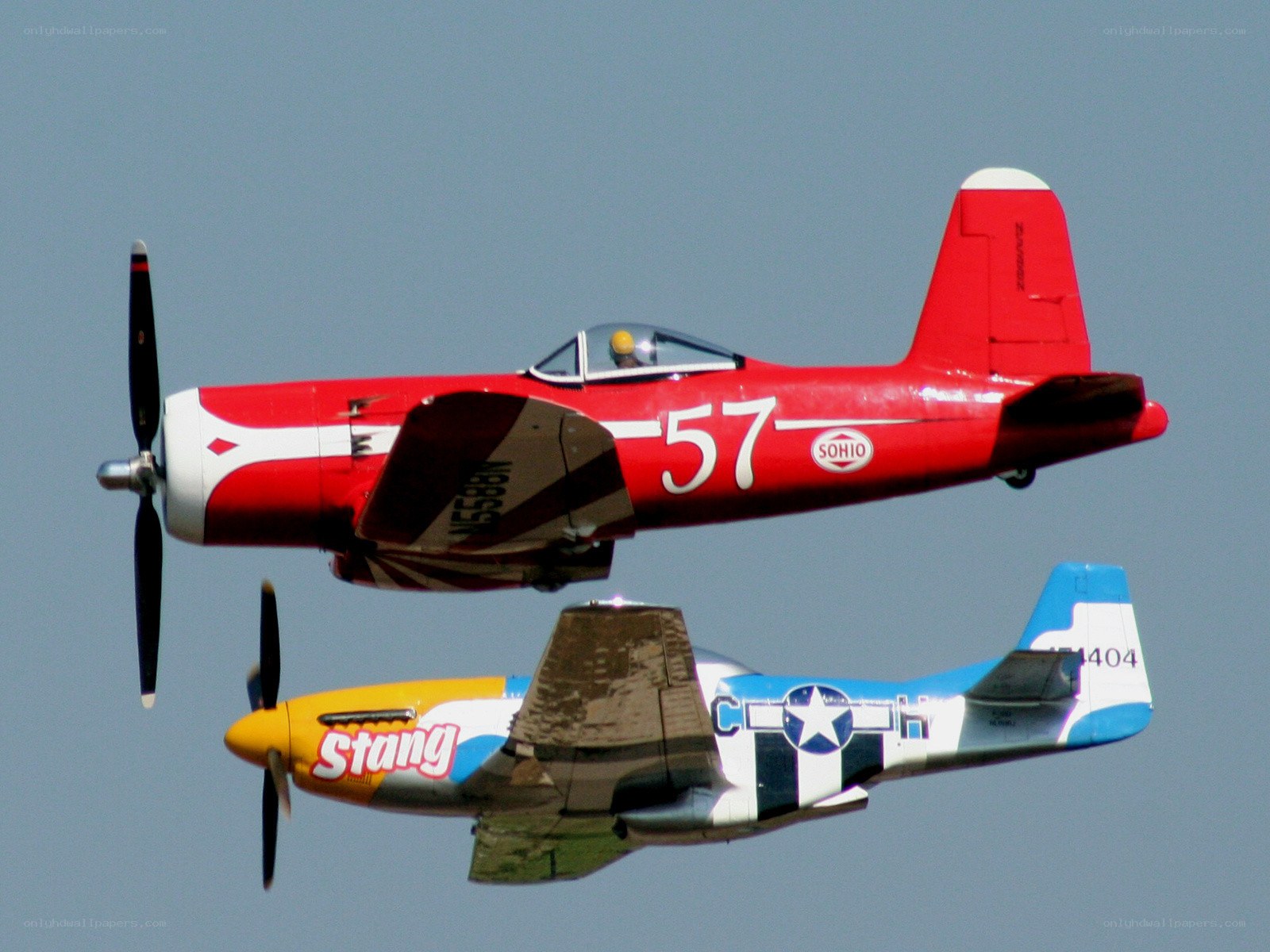 Two vintage planes in flight