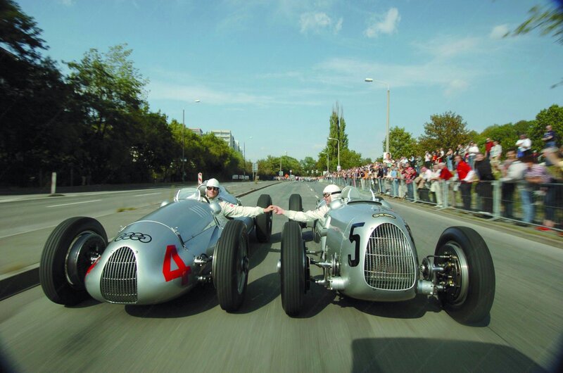 Two vintage race cars racing