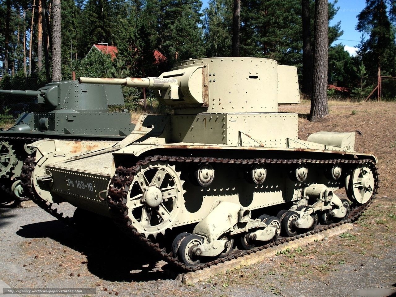 Two vintage tanks on display