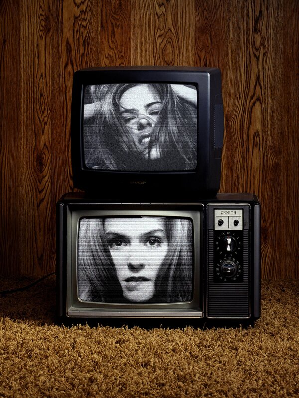 Two vintage TVs with distorted faces