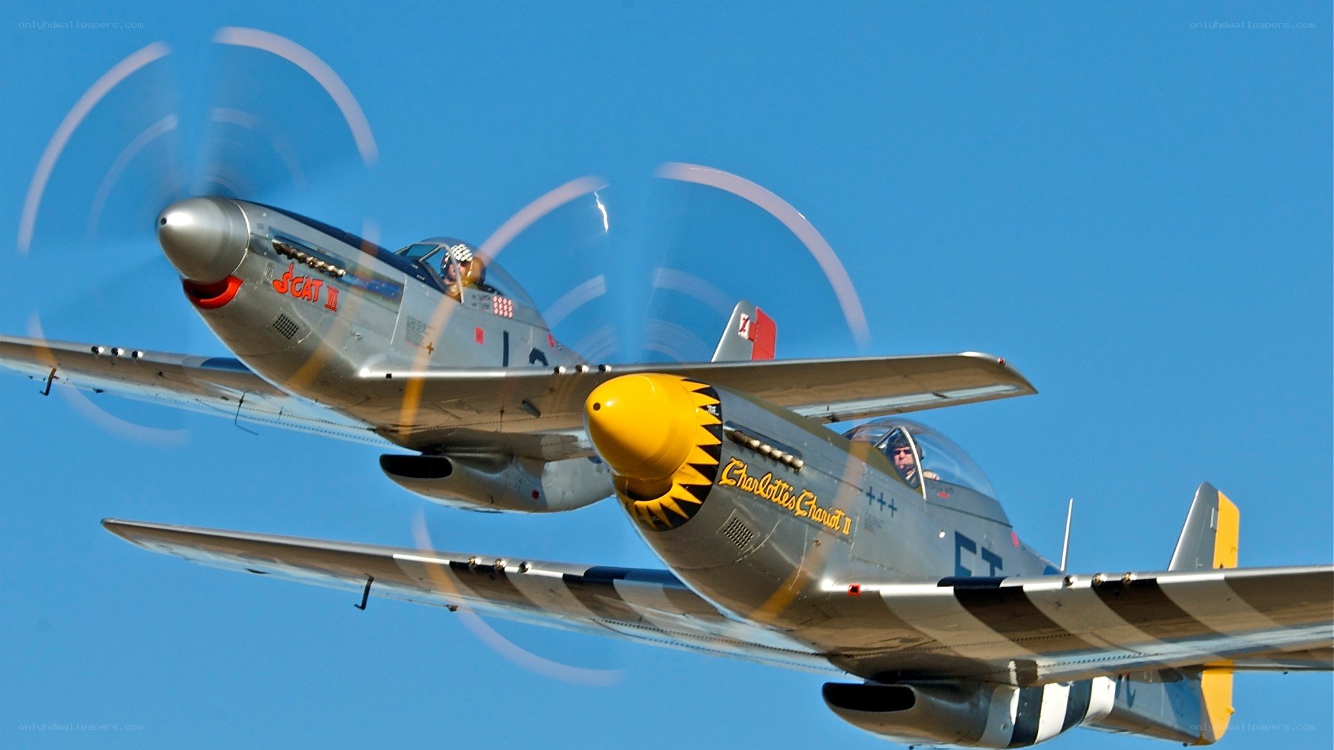 Two vintage warplanes in flight