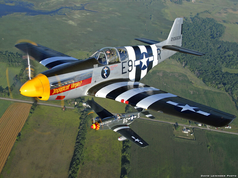 Two vintage warplanes in flight