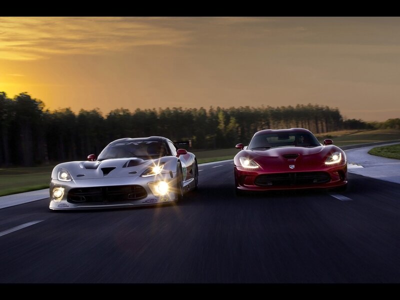 Two Viper race cars on a track