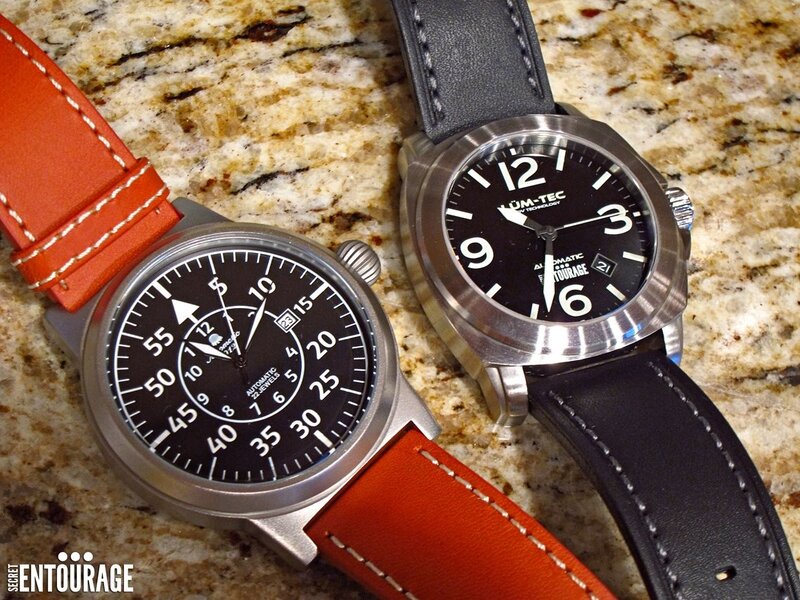 Two watches on a countertop