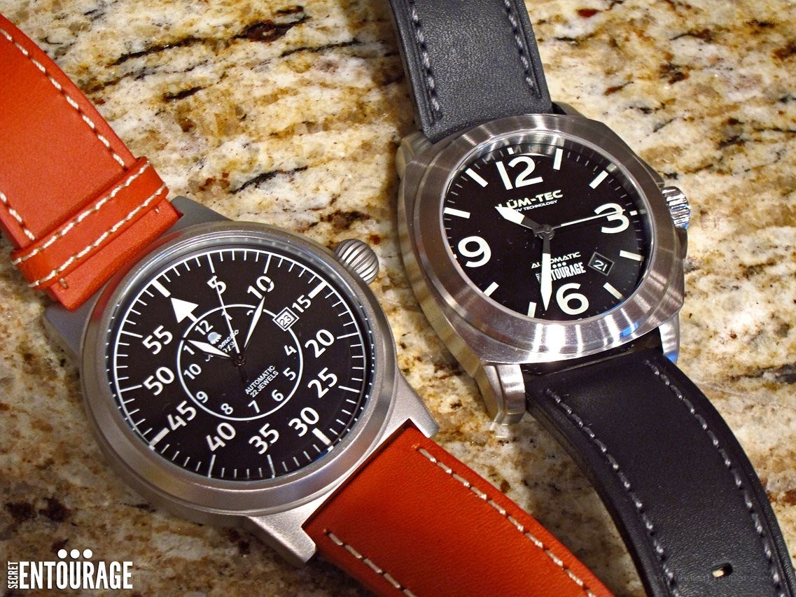 Two watches on a countertop
