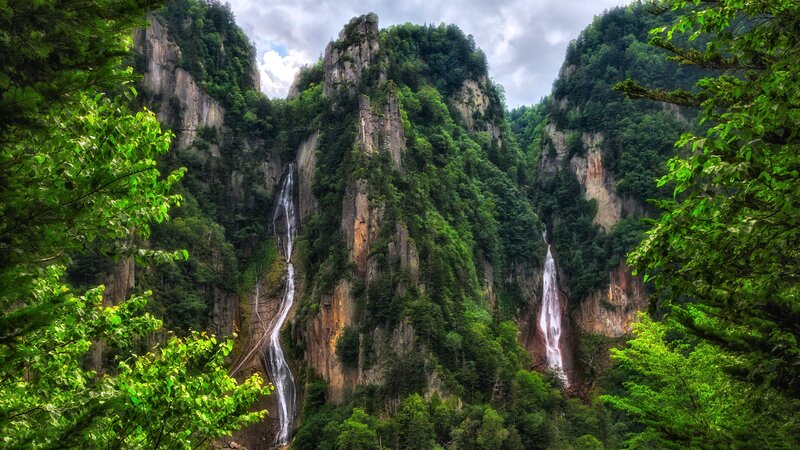 Two Waterfalls on Cliff — Green, Dramatic
