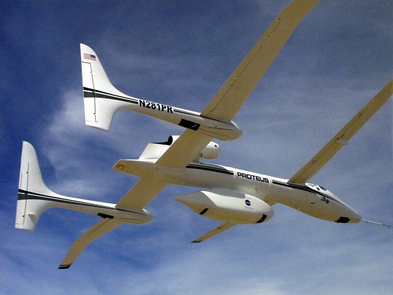 Two White Aircraft in Flight