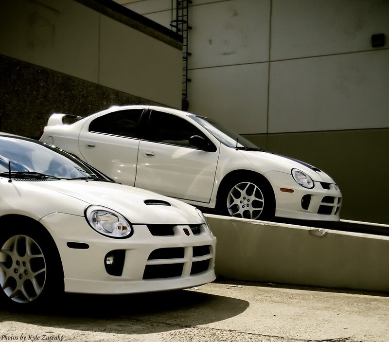 Two white Dodge Neon SRT-4 cars