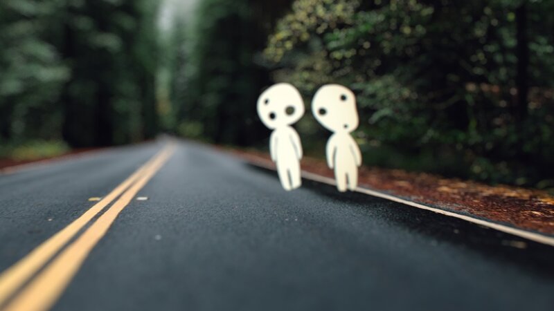 Two White Figures on Road