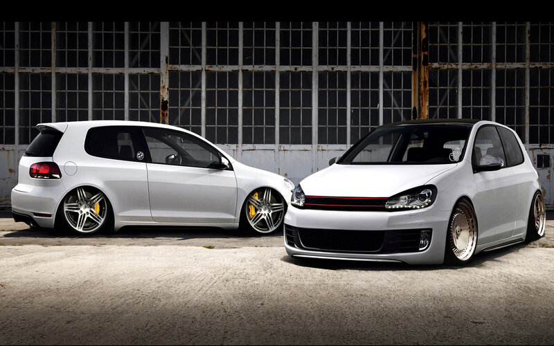 Two White Hatchback Cars