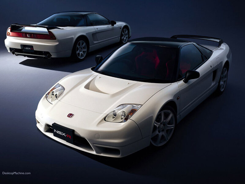 Two white Honda NSX-R sports cars