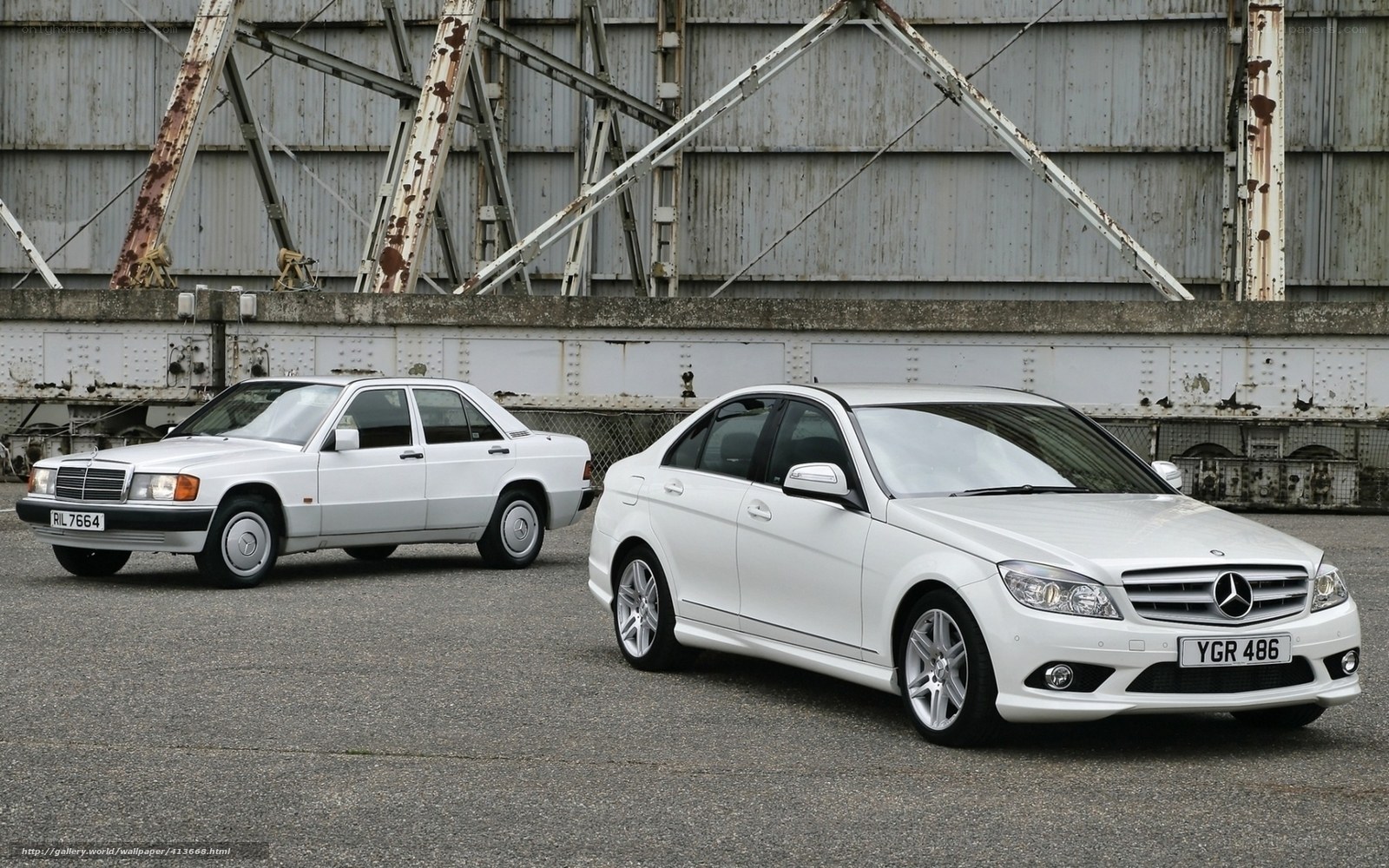 Two white Mercedes-Benz cars