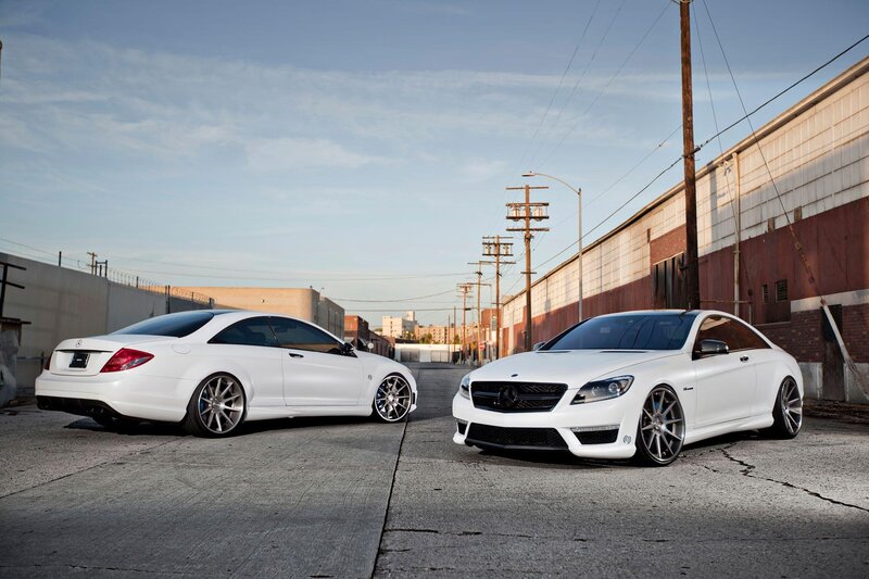 Two white Mercedes-Benz cars