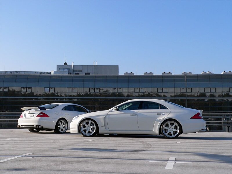 Two white Mercedes-Benz cars