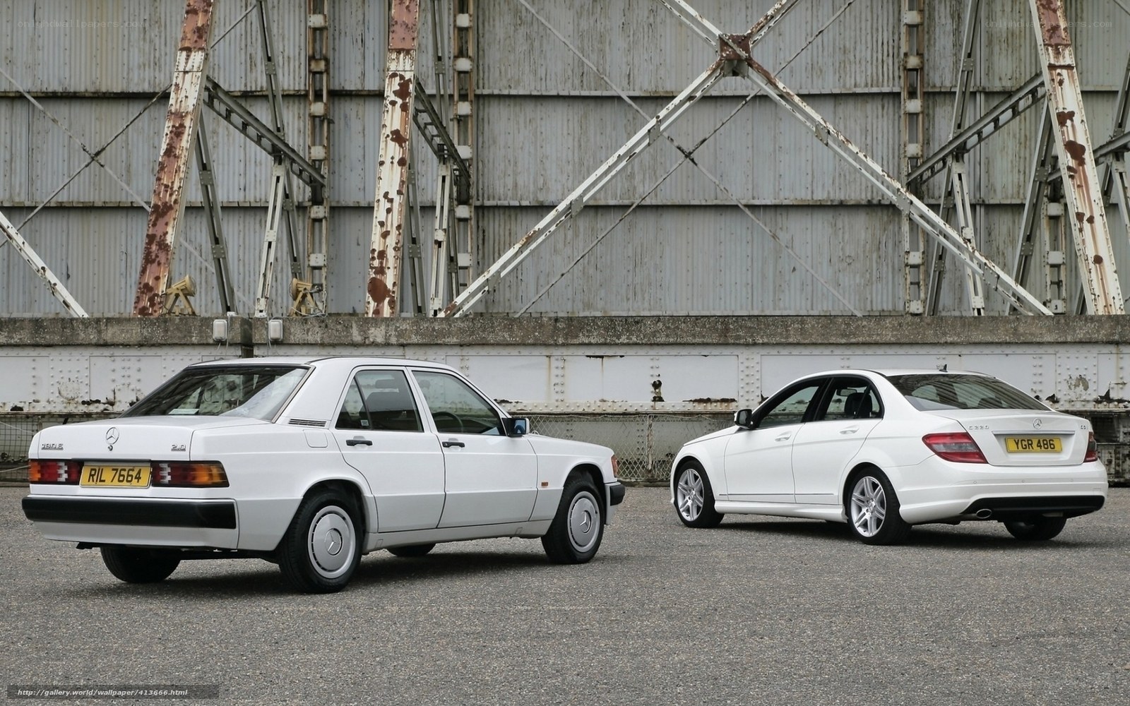 Two white Mercedes-Benz cars