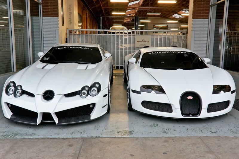 Two white supercars parked