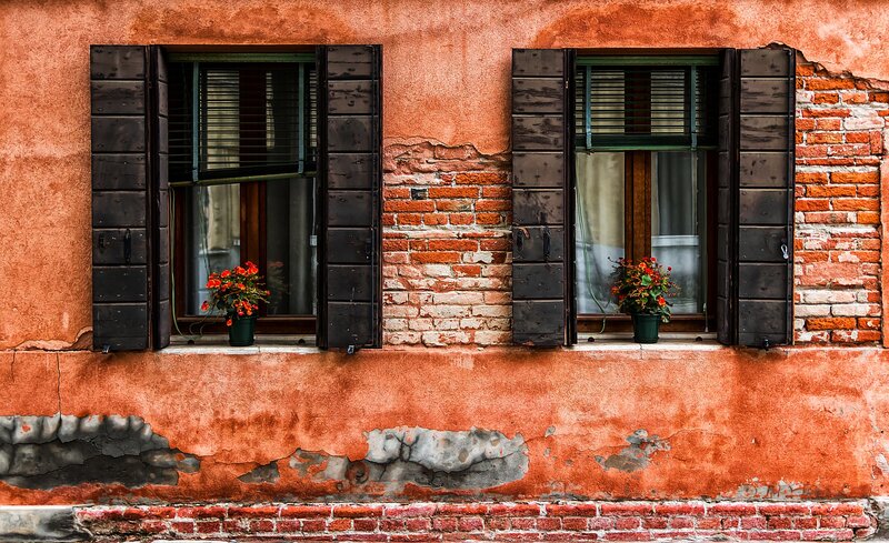 Two Windows on Brick Wall