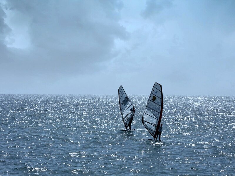 Two Windsurfers on Water