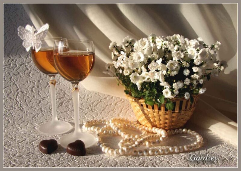 Two Wine Glasses and Flowers